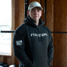 Load image into Gallery viewer, Sam in a Large #TOOSTRONG Hoodie
